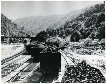Coal cars on train tracks.  