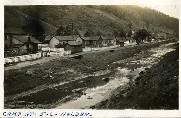 Miner's camp housing area beside a stream. Photograph from Joe Ozanic scrapbook.