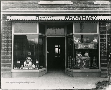 Window Display in Rexall Pharmacy in National Bank building in Alderson W.Va. Building Owned by J.M. Houchins.