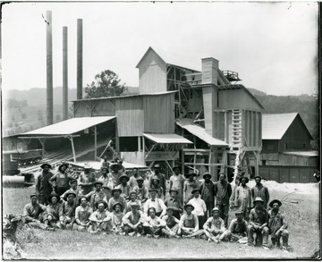 Group portrait of workers in front of Acme Limestone Company Plant, Ft. Spring, W. Va.