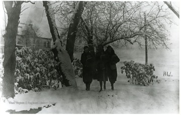 'Annabelle Mayor, Glenna Williams, and June Williams Mayfield walking to school in the snow.
