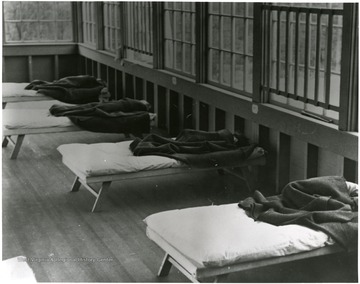 Children sleeping in cots.