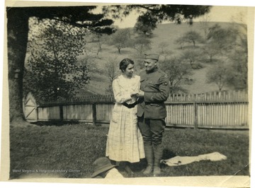 Man in uniform with a woman.