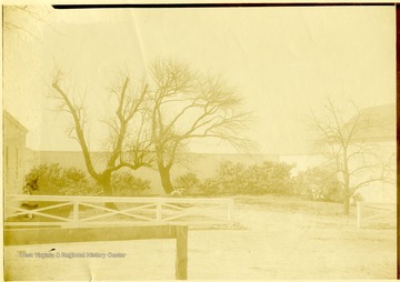 Two men working the the courtyard of the community center.