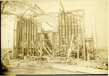 Men taking their lunch break during the 'reconstruction of rebuilt community center.'