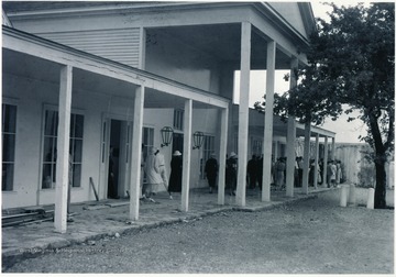 Visitors walking out of the community center at Arthurdale.