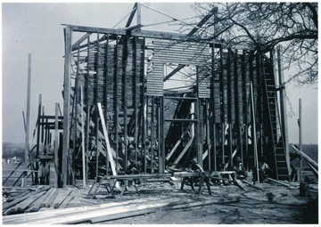 Men taking a break to each lunch during the 'reconstruction of the rebuilt community center at Arthurdale.'