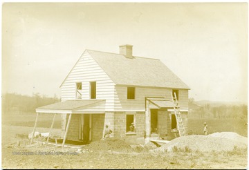 Men working on a house in Arthurdale.