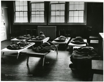 Children sleeping on cots.