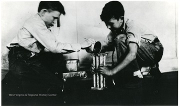 'Two boys making candles in pioneering activity at the Arthurdale School.'