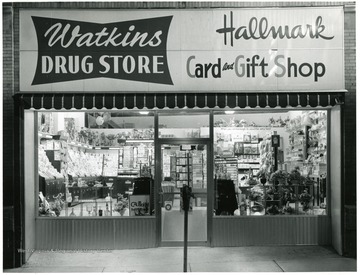 Store front of the Watkins Drug Store and Hallmark card and gift shop.