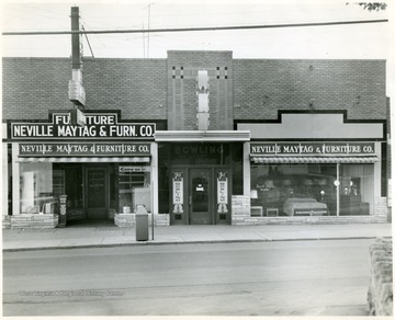 'Exterior of Neville Maytag and Funiture Co., 527 Neville St. Copyrighted 1955, All Rights Reserved by Harlow Warren, 320 North Kanawha st., Beckley, W. Va.'