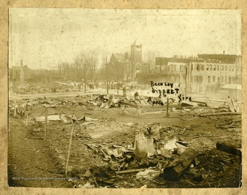 People stand among the ruins of buildings after the Beckley Fire of April 13, 1912 which destroyed much of the town west of the courthouse.