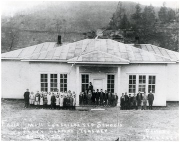 Children line up in front of the Falls Mill School for a group portrait.   Perry Rexroad, Teacher