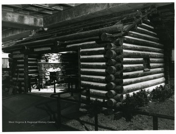 Log Cabin in State Museum of the Science and Culture Center.  'The Settler's Cabin in the State Museum of the Science and Culture Center captures the mood and mode of life for early pioneers who tilled the ground we live on today.  The Cabin is one of 16 exhibits which trace the progress of West Virginians through the years.'