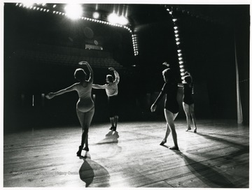 Dancers facing the audience on stage.  'West Virginians will be the stars of the stage of the new West Virginia State Theater in the Science and Culture Center.  The two-level facility, which seats up to 500, will be available for bookings at no cost for the presentation of West Virginia talent through performances, series, festivals and workshops.'