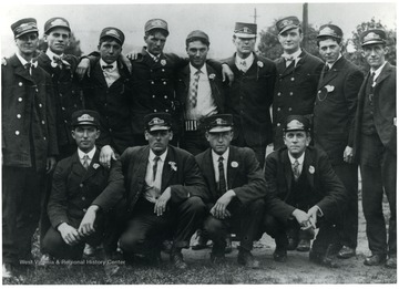 Group portrait of streetcar workers in their uniforms.