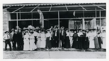 Group portrait of Parsons-Souders employees.  Arthur Parsons and Lloyd P. Souders, the founders of the store, are standing near the pole in the center of the picture wearing derby hats.  Mr. Parsons is the taller of the two men.  