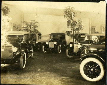 Several cars are in an unidentified showroom, in Clarksburg, West Virginia.