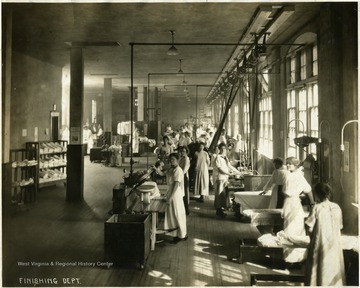 Women at work in the Finishing Department at the Empire Laundry Company.