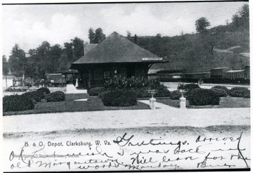 Postcard showing the B&amp;O depot and railroad cars.