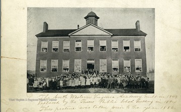 Front:  The North Western Virginia Academy built in 1843.  Replaced by the Towers Public School building in 1894.  This picture was taken prior to the year 1886.    Back: 'And don't you remember the School Ben Bolt.  With the master so cruel and grim and the shanded nook in the running brook- Where the children went to swim- Grass grows on the masters grave Ben Bolt.  The spring of the brook is dry.  And of all the boys who were schoolmates then there are only you and I.'