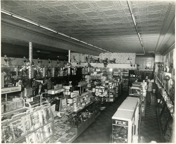 Customers are shopping in Neale's Drug Store on Davis and Third Streets, in Elkins, West Virginia.
