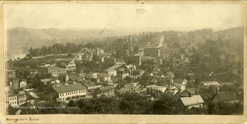 View of Fairmont, West Virginia from Hamilton's Hill.  Homes and businesses of Fairmont are bounded by the Monongahela River on the right side of the photograph.  Fairmont Normal School building is the tall building in the upper center of the image.