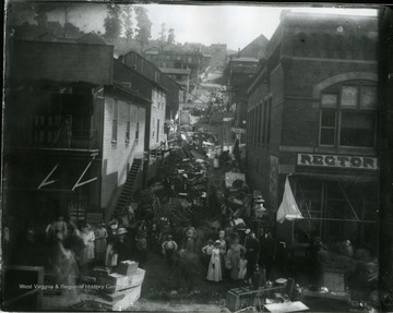 People gathered with their belongings in the streets after a fire in Grafton, W. Va.