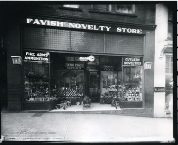 Front entrance and window displays of Favish Novelty Store in Grafton, W. Va.  Children's riding toys at the entrance.