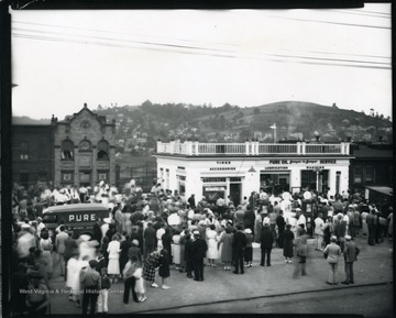 A large crowd outside the Pure Oil Gas Station in Grafton, West Virginia.