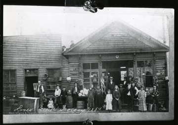 People stand in front of Laves Corner Grocery Store in Grafton, West Virginia.
