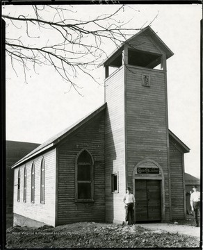Two men stand in front of the Church of the Nazarene in Grafton, West Virginia.