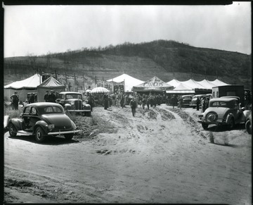 People gathered near tents and booths of the Wallace Brothers Circus at the Old Fairground on Riverside Drive in Grafton, West Virginia.