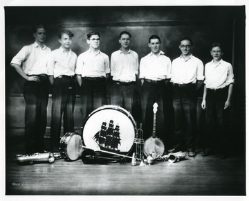 Group portrait of members of the High Hatters Orchestra in Graf., pose for a group portrait.
