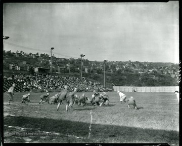 A football game in progress at the field on Riverside Drive.