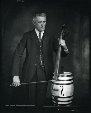 A man is playing barrel bass in Grafton, West Virginia.