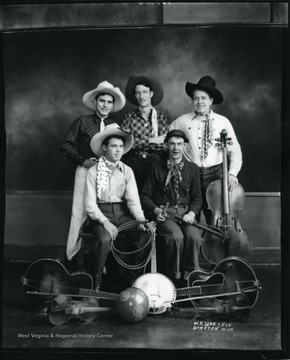 Members of a string band pose for a group portrait.