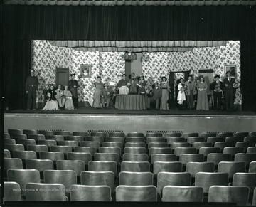 Grafton High School Thespians in costume on stage.