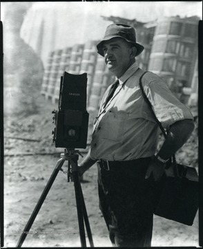 Mr. Albright, photographer, in Grafton, W. Va. standing with his camera