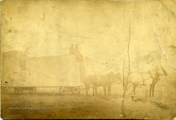 'Horse-drawn studio used in Nebraska by Loar of Grafton, W. Va.  Dark room in West in about 1885.  Building at 117-119 W. Main Street, Grafton, W. Va.  Pictures made in studio after purchased building.  Built new building in 1902.'