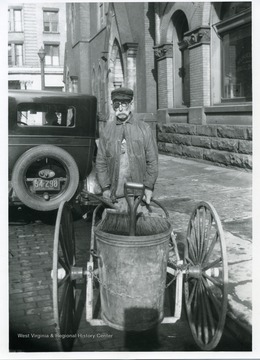 A street cleaner with his equipment in Grafton, West Virginia.