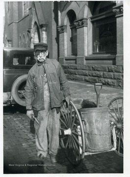 A street cleaner and his equipment in Grafton, West Virginia.