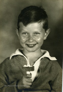 A young boy enjoys eating his ice cream.