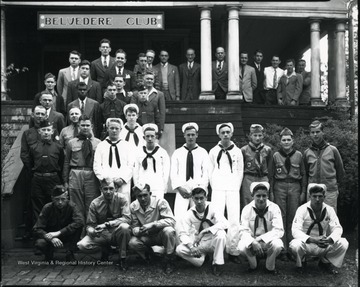 Boys in uniform stand in front of the Belvedere Club.