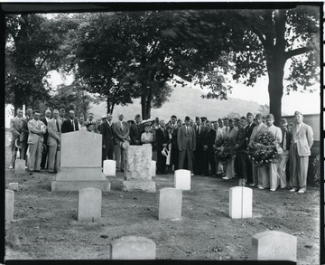 People attend a funeral ceremony at the National Cemetery on Walnut Street, in Grafton, West Virginia.