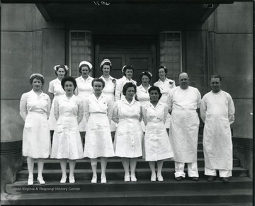 Staff stands for a group portrait.