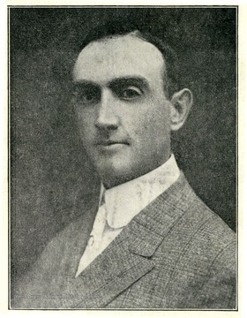 Image from 'Industrial and Picturesque Clarksburg, W. Va.' published by the Press of the Clarksburg Telegram Company, Printers and Publishers, Clarksburg, W. Va., 1911. Portrait of Frank R. Moore.