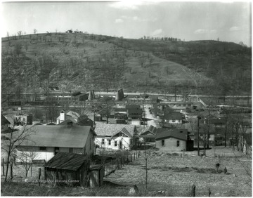 View of houses and the Carr China Co. in Grafton, W. Va.  Sign reads 'Vitrified Hotel China'.