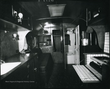 Resting area and bathroom inside a camper, Grafton, W. Va.